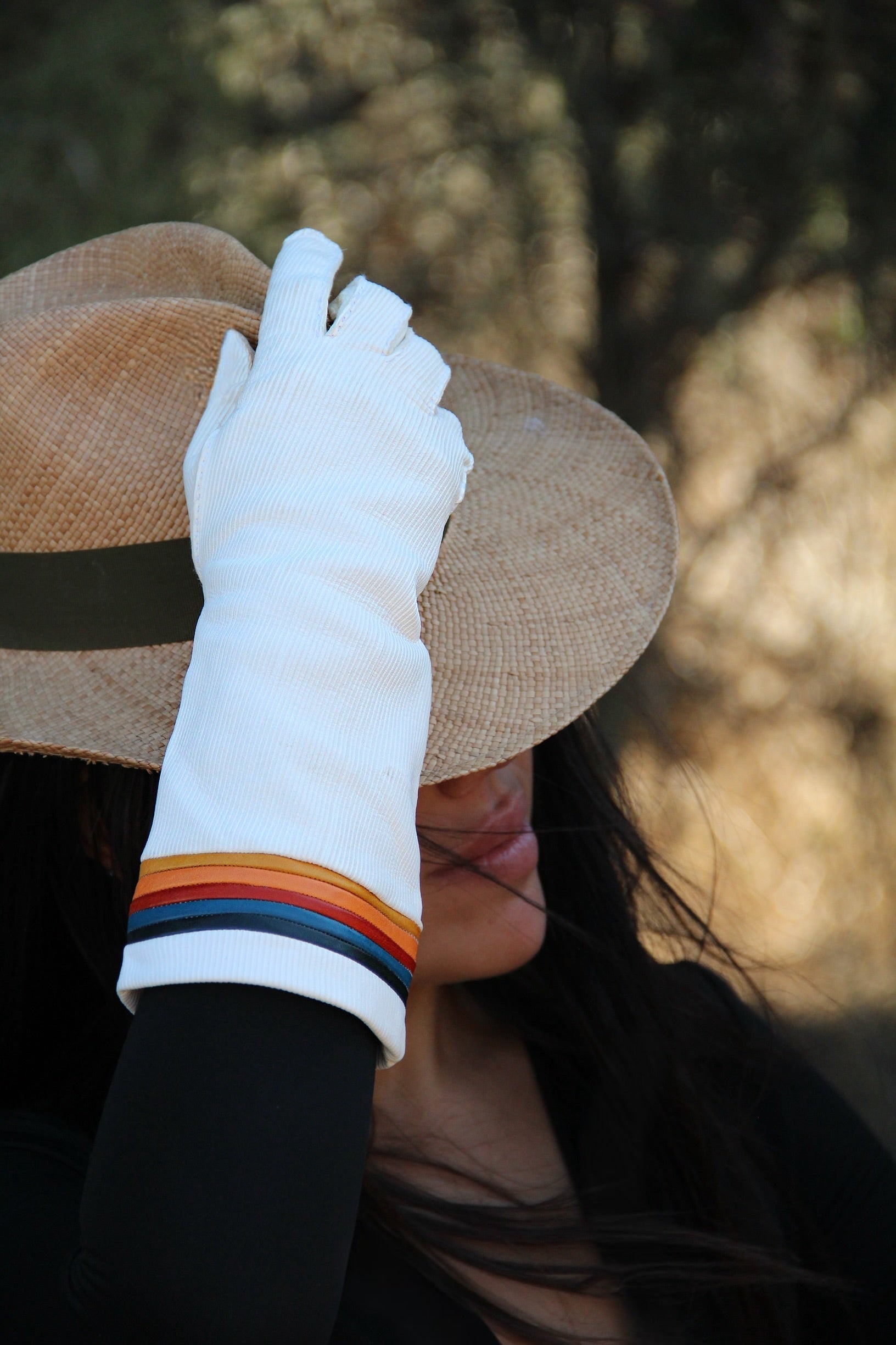 Roxy 82 white long leather gloves with striped cuff worn with a straw hat