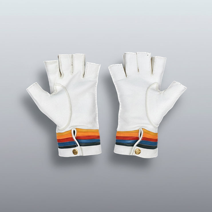Pair of white fingerless gloves with rainbow bands on a gray background